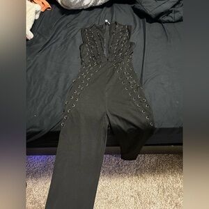 Hot Miami Styles Black Jumpsuit with Grommet Accents